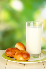 Bread rolls and glass of milk