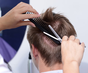 Naklejka premium Young man in beauty salon