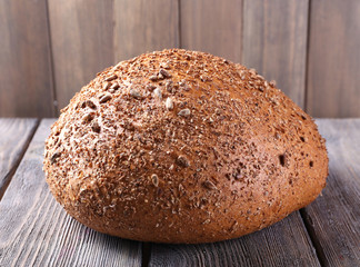 Fresh bread on wooden table, close up