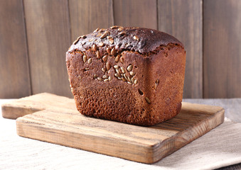 Fresh bread on wooden table, close up