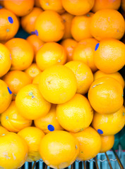oranges in supermarket cart