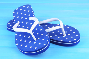 Color flip-flops on wooden background