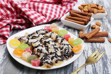 Sweetened fried banana on plate, close-up