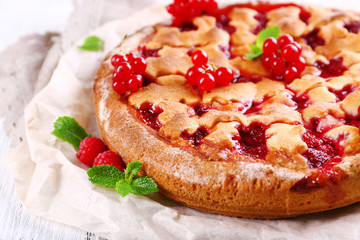 Tasty cake with berries on table close-up