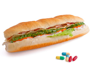 Pills and two hot dogs with various ingredients