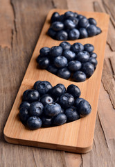 Delicious blueberries on table close-up