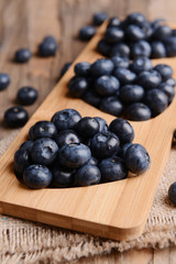 Delicious blueberries on table close-up