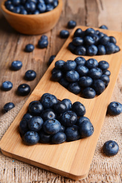 Delicious blueberries on table close-up