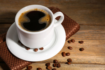 Cup of coffee on wooden background