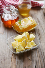 Lemon and honey on wooden table