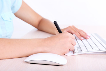 Businesswoman at her workplace, close-up