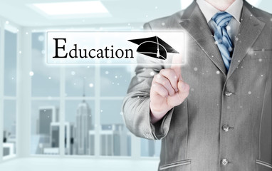 business man pointing 'education' concept