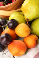 Ripe fruits on table close up