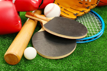 Sports equipment on grass background