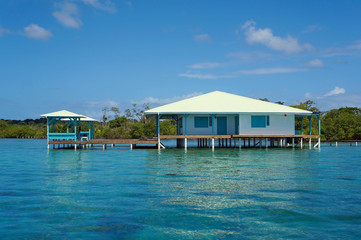 Caribbean house on stilts over water