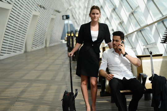 young business people waiting in a public transportation station