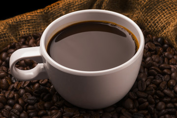 Hot Cup of Coffee With Coffee Beans