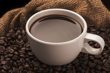 Hot Cup of Coffee With Coffee Beans