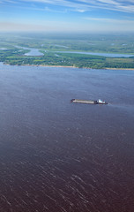 Transporting gravel on the cargo ship on the river