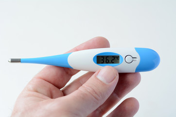 Man hand holds Thermometer