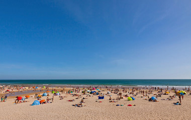 Crowded Atlantic summer beach in Portugal