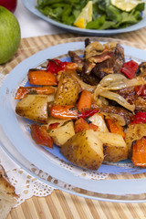  baked meat with potatoes, and watercress salad.