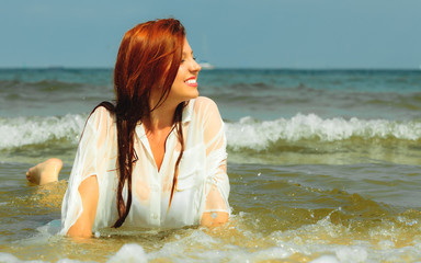 Vacation. Girl in water having fun on the sea.