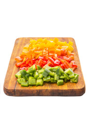Colorful chopped capsicums wooden cutting board 