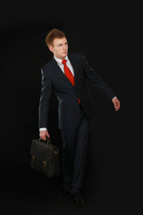 Portrait of successful business man with bag