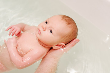 Newborn baby in a bath