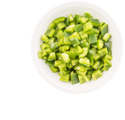 Chopped green capsicums in white bowls over white background 