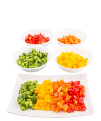 Colorful chopped capsicums in a plate and bowls