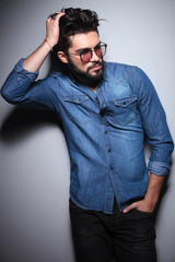 fashion man passing  hand through his hair