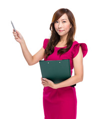 Mature businesswoman with clipboard pen up