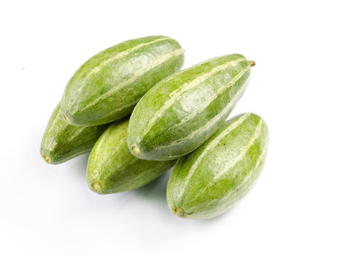Pointed gourds over white background
