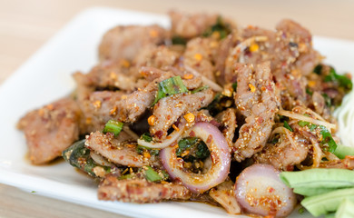 Grilled Pork in North Eastern Thai Style Spicy Salad  closeup