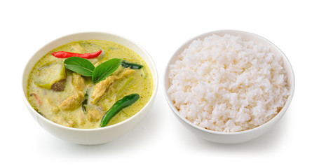 Thai food chicken green curry in the white bolw and rice on whit