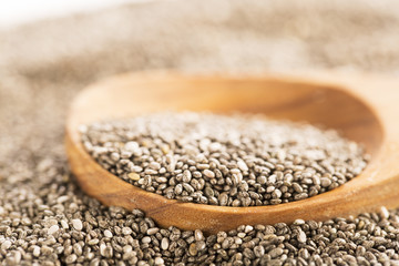 Dark Chia Seeds On Wooden Spoon