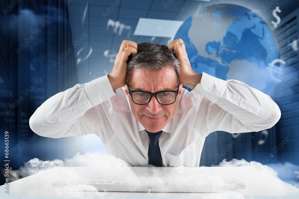 Aufkleber Composite image of stressed businessman using a keyboard