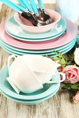 Lots beautiful dishes on wooden table close-up