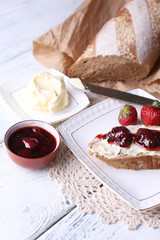 Fresh toast with homemade butter and strawberry jam