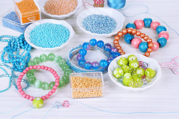 Materials for manufacture of jewelry on table close-up