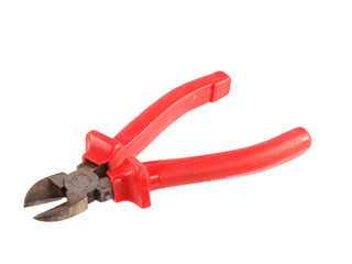 Close up of red handled wire cutter on a white background.