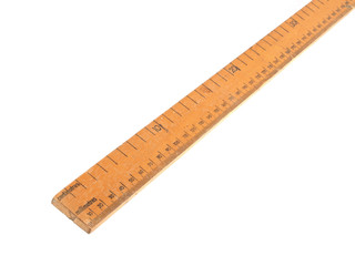 Close up photo of a wooden meteric ruler on a white dackground.