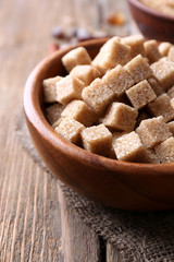 Brown sugar cubes, reed and crystal sugar in bowl