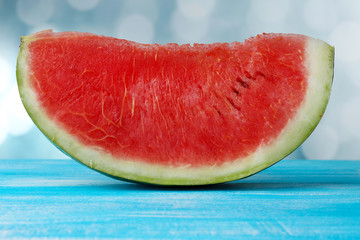Fresh slice of watermelon on blue background