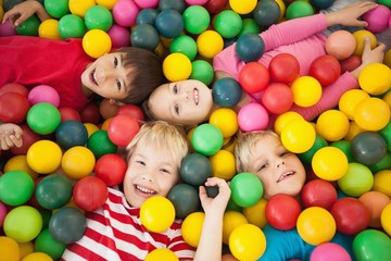 Happy children playing in ball pool