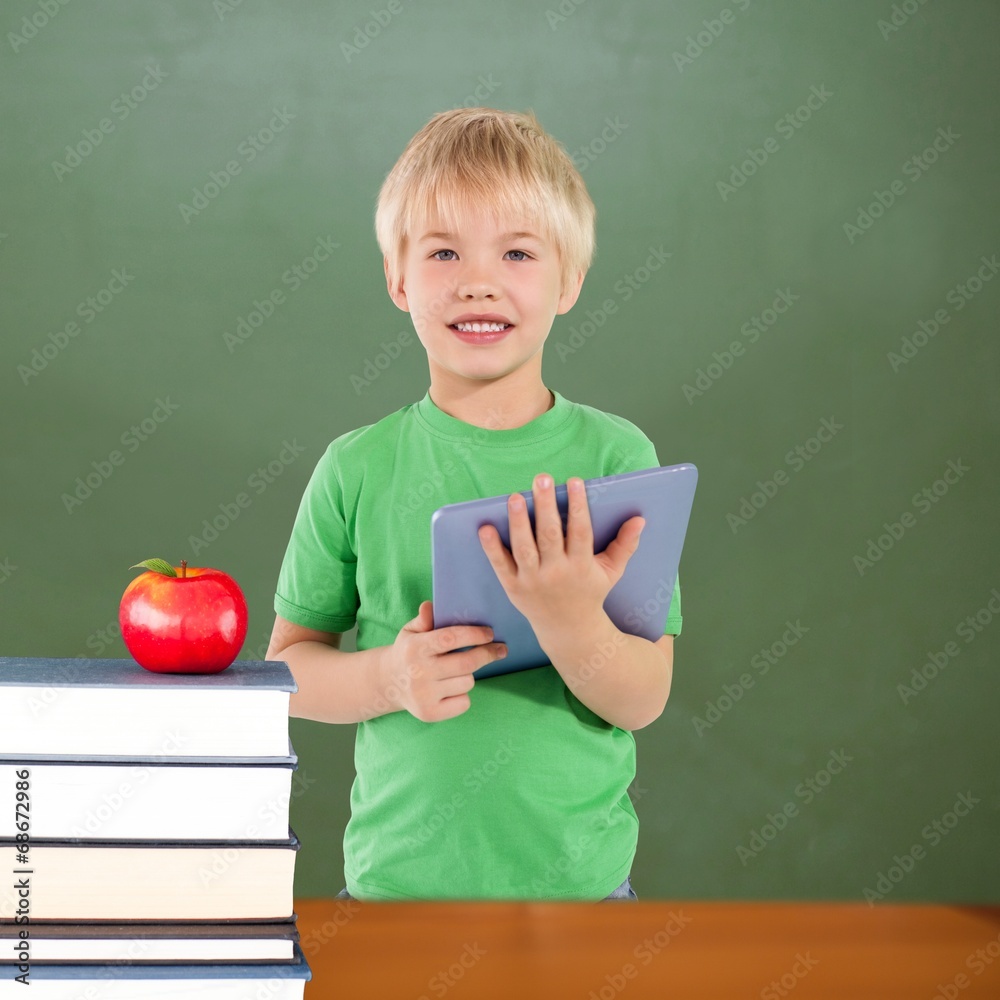 Poster composite image of cute boy using tablet