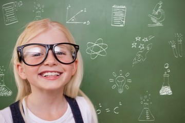 Composite image of cute pupil smiling