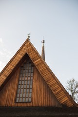 Fototapeta na wymiar Church roof with little cross.